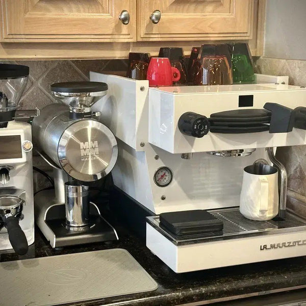 White E64 WS beside a Linea Mini in a home bar